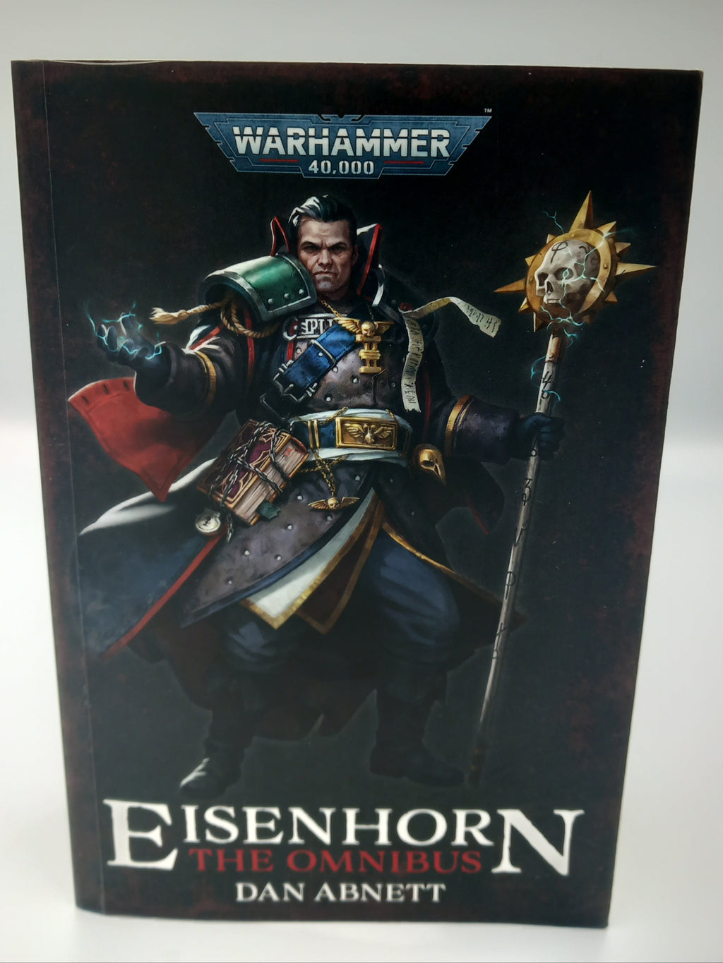 Book cover of 'Eisenhorn' by Dan Abnett with Warhammer logo on a white background