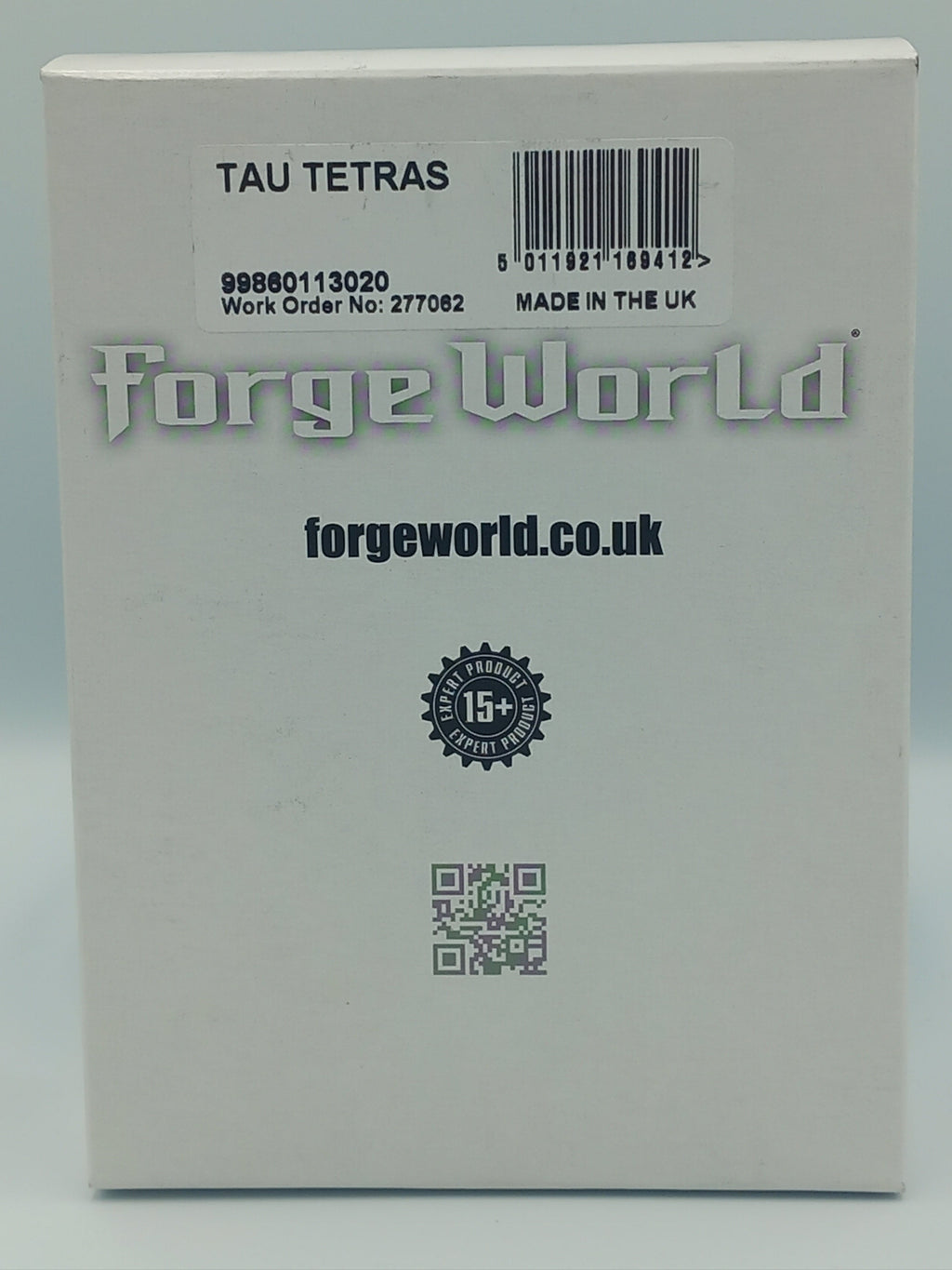 Tau Tetras Product packaging with 'forge world' branding on a light gray background