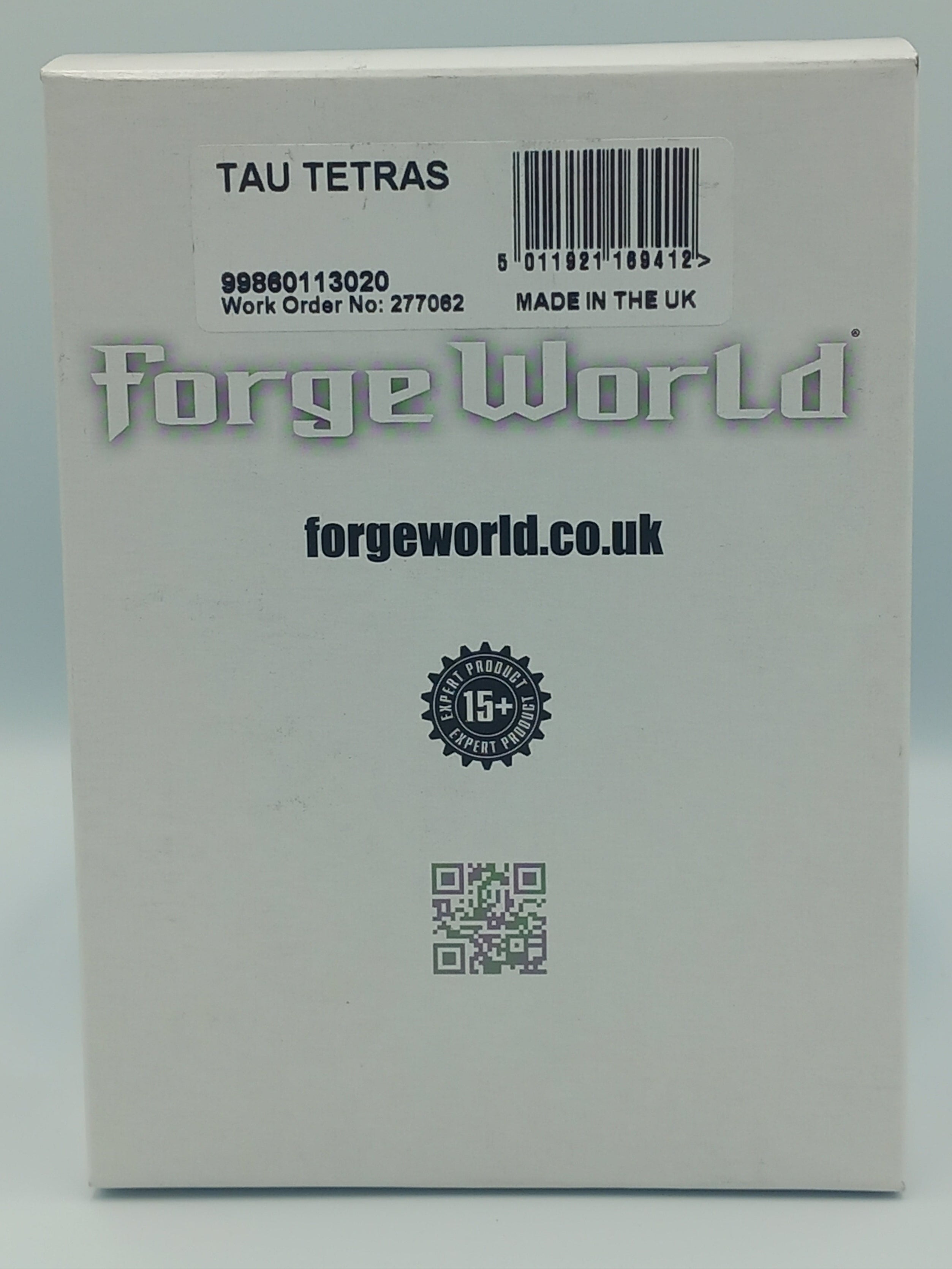Tau Tetras Product packaging with 'forge world' branding on a light gray background