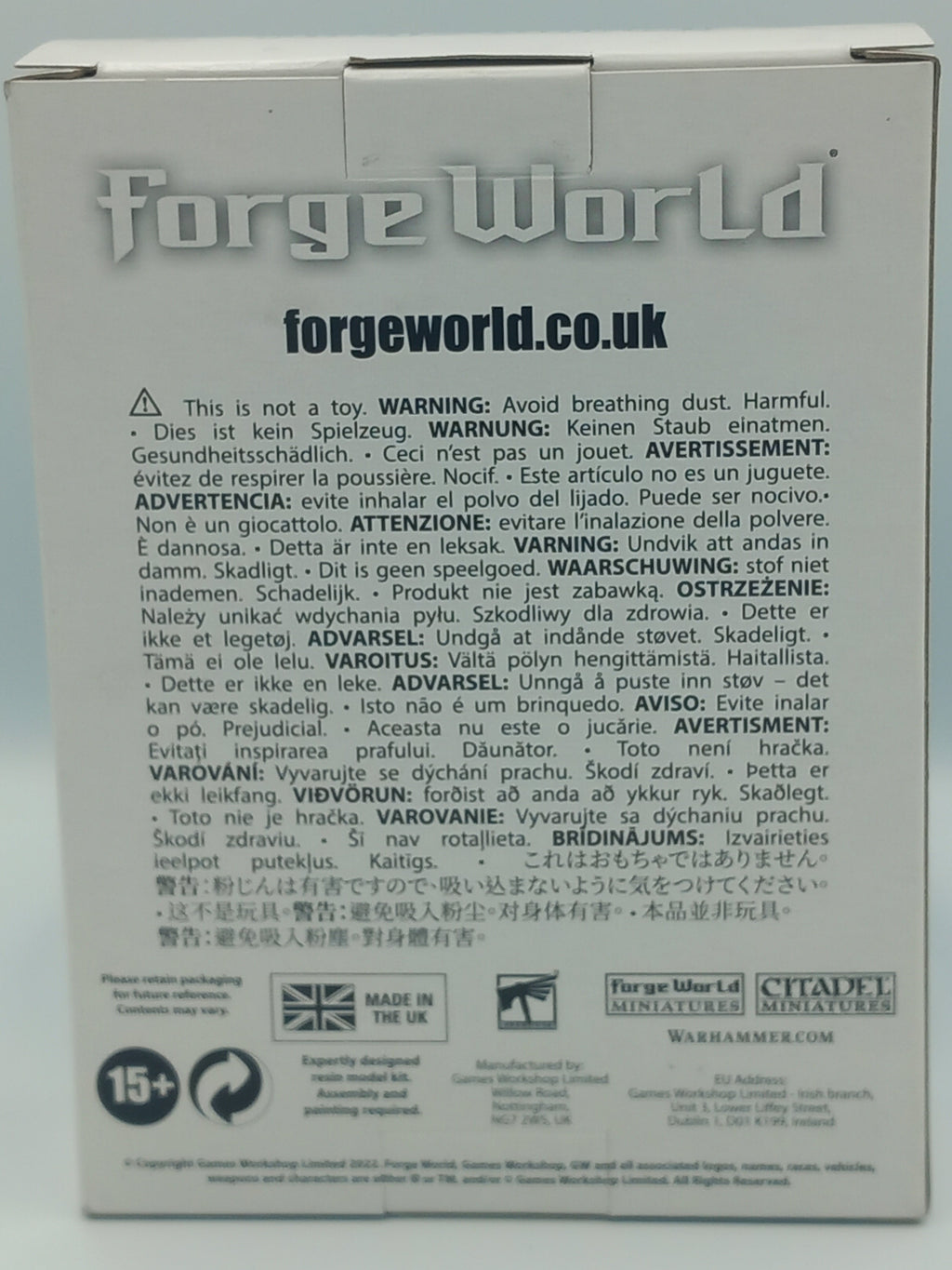 Tau Tetras Forge World product packaging with text and branding on a light gray background