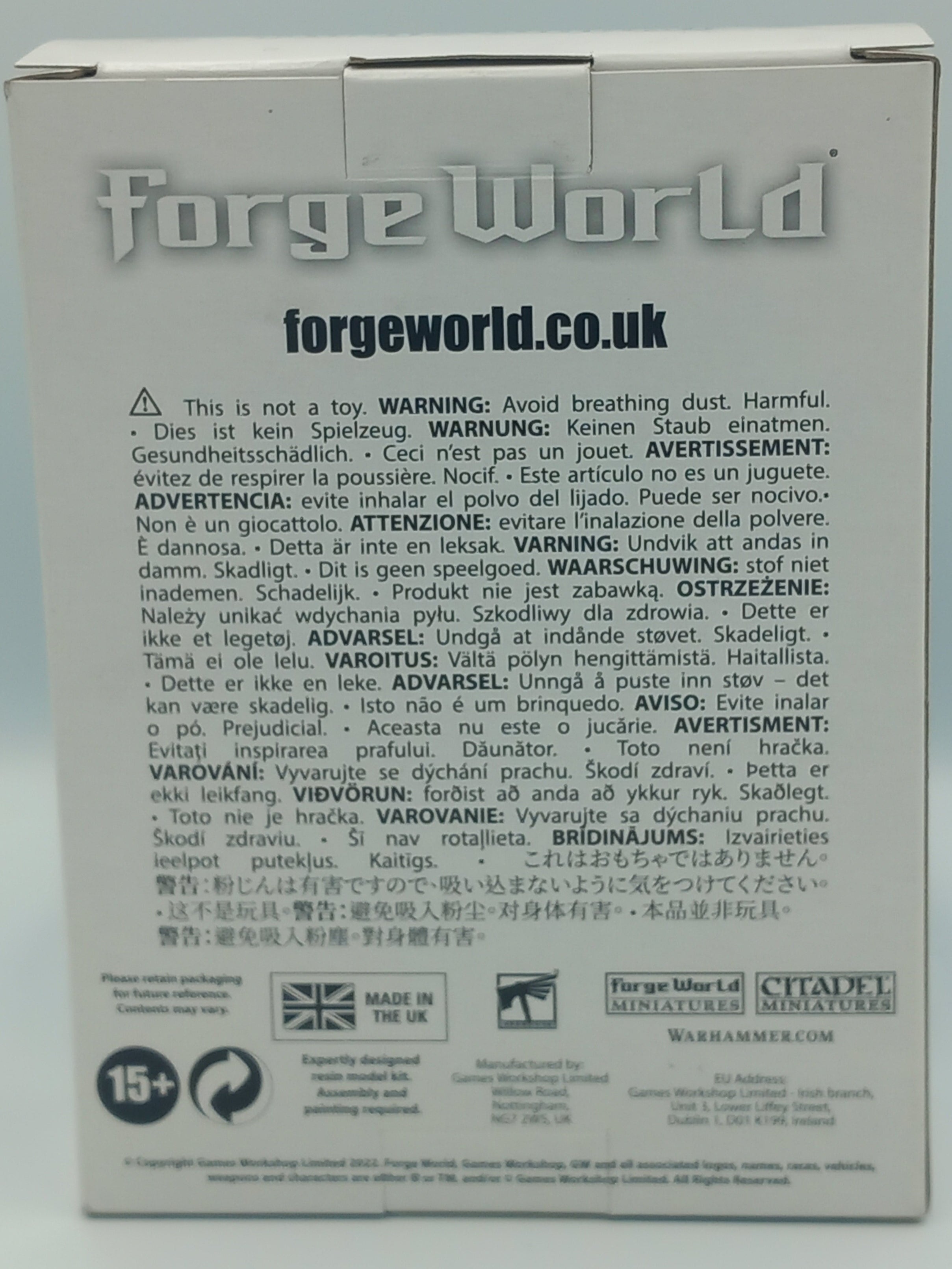 Tau Tetras Forge World product packaging with text and branding on a light gray background